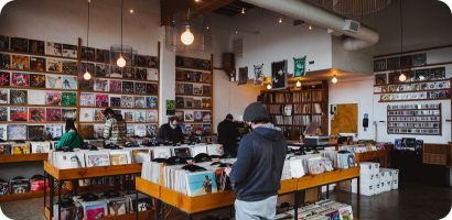 People browsing vinyl records in cozy shop